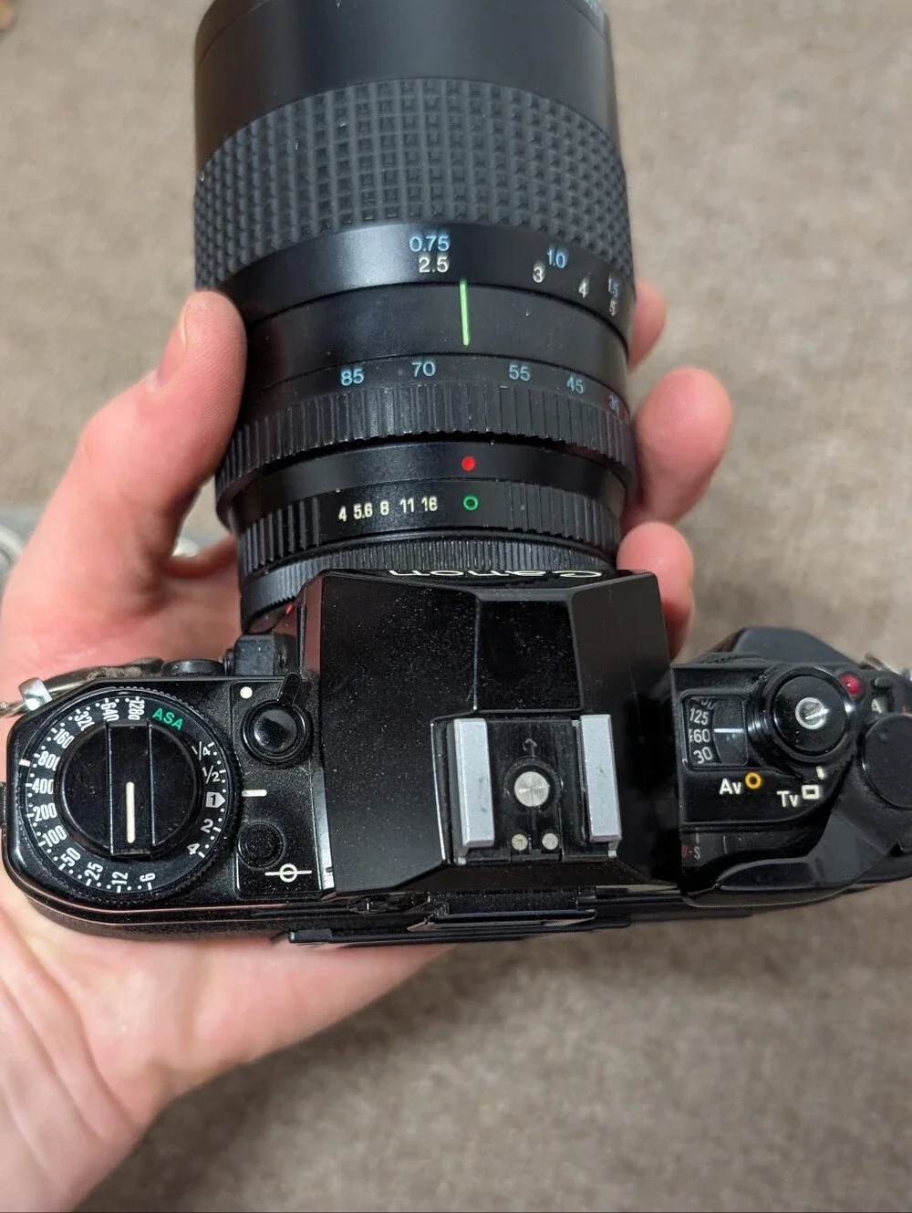 Vintage Canon A-1 Black SLR Camera with Black Lens and Black Flash